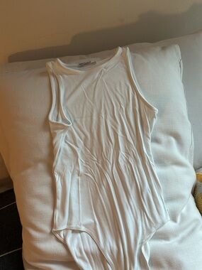 White Sleeveless Bodysuit by Moyiko